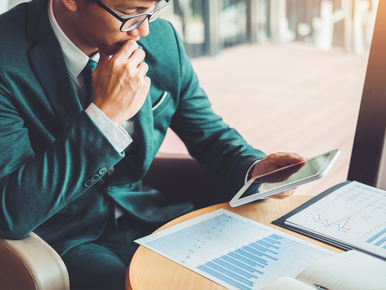 Banker looking at investments 772x579 .png