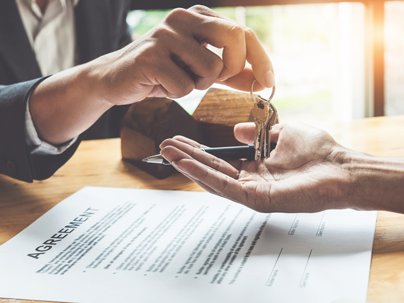 Banker putting keys into hands 1800x1350.png