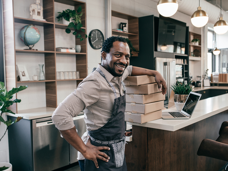 Business owner with boxes 1800x1350.png