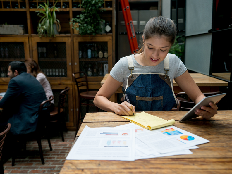 Business owner writing a plan 1800x1350.png