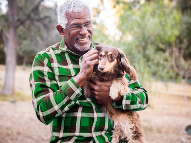 Guy holding dog 772x579 .png