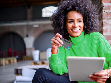 Lady smiling with debit card 772x579.png