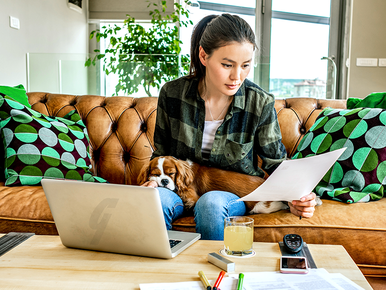 Lady with laptop and papers 772x579.png