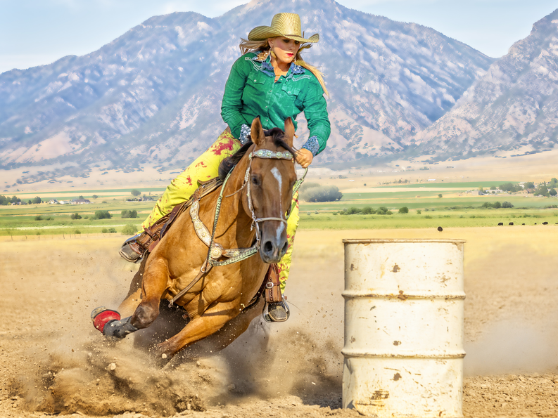 Woman barrel racing 1800x1350.png